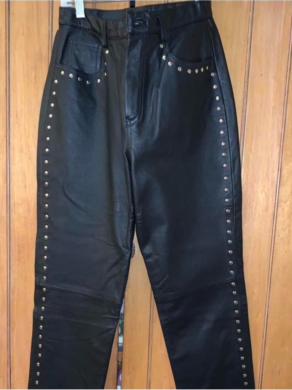 Black leather pants with grommets